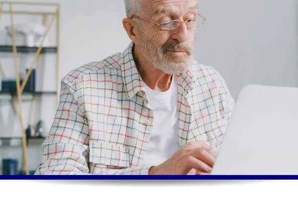 Senior working on a laptop