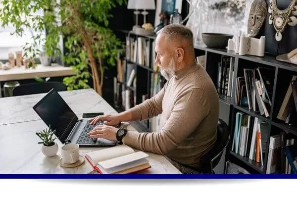 Senior working on a computer